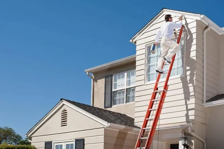 Exterior painting work in progress in a modern villa community